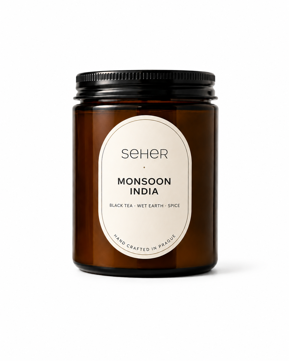 Seher Monsoon India luxury scented candle in an amber glass jar inspired by India's monsoon season with black tea, wet earth and spice notes.